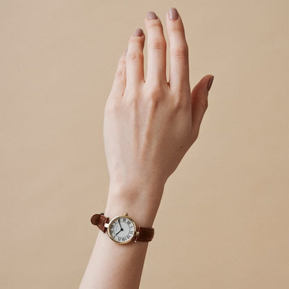 AURA ROUND GOLD BROWN LEATHER