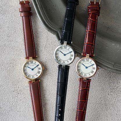 AURA ROUND GOLD BROWN LEATHER
